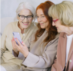 Three ladies communicating using phone 